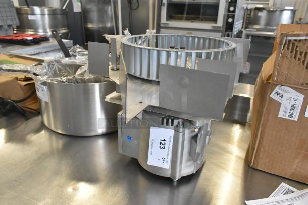 Brand new scratch and dent Nidec convection oven motor, 115-120V, 1 phase, with visible auction tag "123".