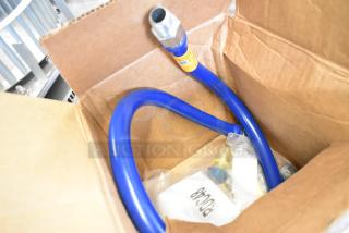 Brand new Dormont gas hose, blue, scratch and dent condition, includes packaging and connectors, visible markings on label.