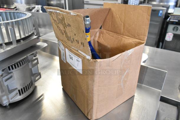 BRAND NEW SCRATCH AND DENT! Dormont gas hose in an open, slightly damaged box. Hose and fittings visible.