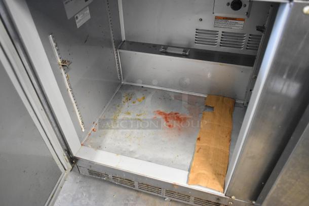 Beverage Air UCR48A-23 stainless steel undercounter cooler, 2 doors. Interior shows visible wear and staining. 115 volts, 1 phase.
