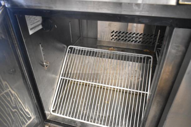 2016 Atosa MGF8406 stainless steel undercounter freezer, 2 doors, commercial casters, 115V, 1 phase, interior view.