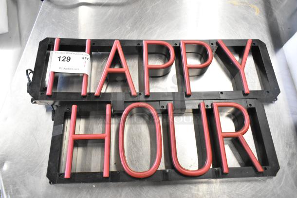 "Happy Hour" light-up sign, red lettering, 115 volts, 1 phase, black frame, auction tag visible, great condition.
