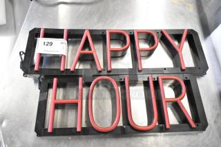"Happy Hour" light-up sign, red lettering, 115 volts, 1 phase, black frame, auction tag visible, great condition.
