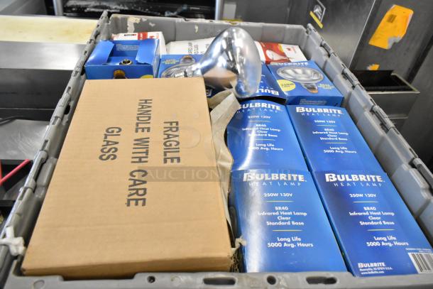 Poly bin with new items including Bulbrite Infrared Heat Lamp Bulbs, and a "Fragile Handle with Care Glass" box.