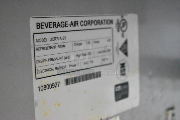 Beverage Air UCR27A-23 stainless steel undercounter cooler label. Details include model, refrigerant R134a, 115 VAC, phase 1.