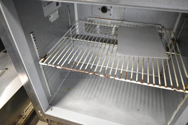 Beverage Air UCR27A-23 undercounter cooler interior; shows rust on shelf, stainless steel construction, 115V, 1-phase.