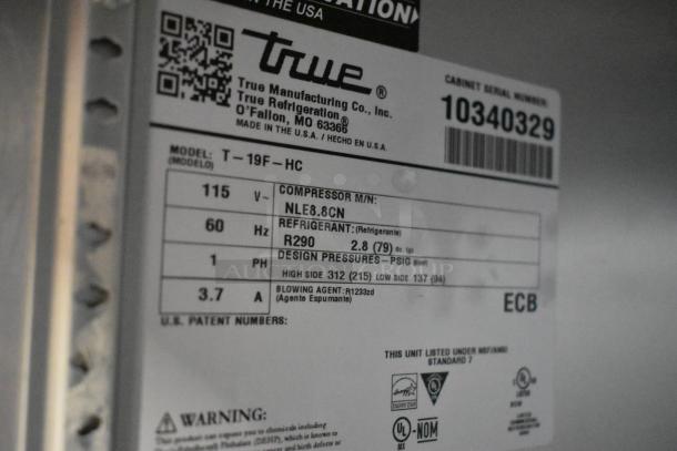 2022 True T-19F-HC stainless steel freezer label showing model, voltage, refrigerant type, and serial number details.