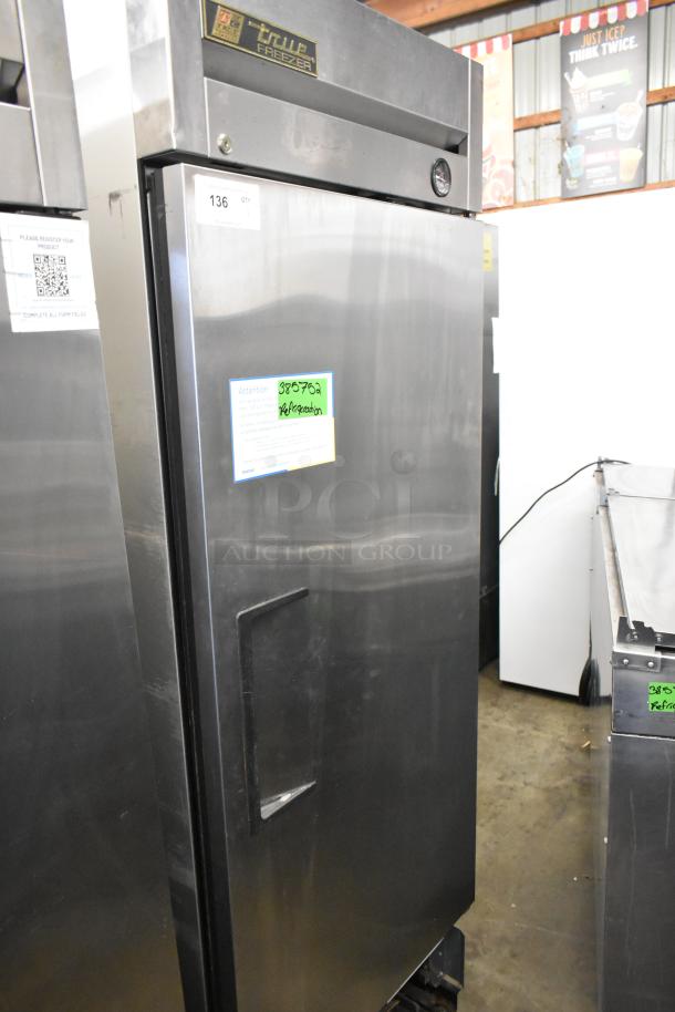 2016 True T-19F stainless steel commercial freezer, single door, on casters. 115 volts, 1 phase, visible label and markings.