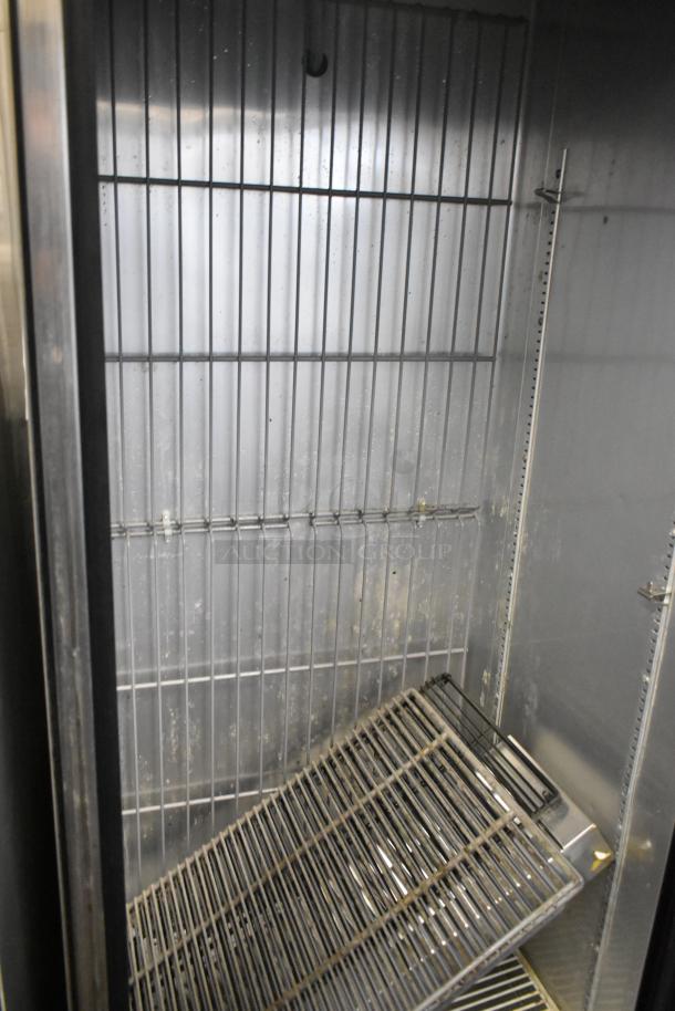 2016 True T-19F Stainless Steel Single Door Freezer with commercial casters; interior shelves shown, 115V, 1 Phase.