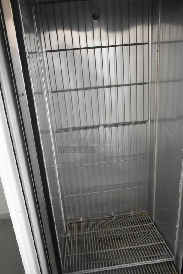 2017 True T-19F stainless steel commercial freezer, single door, poly coated racks, excellent condition, 115V, 1 Phase.