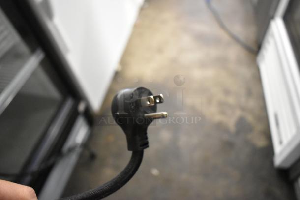 Close-up of a 115-volt plug for the 2017 True T-19F stainless steel commercial freezer with poly-coated racks.