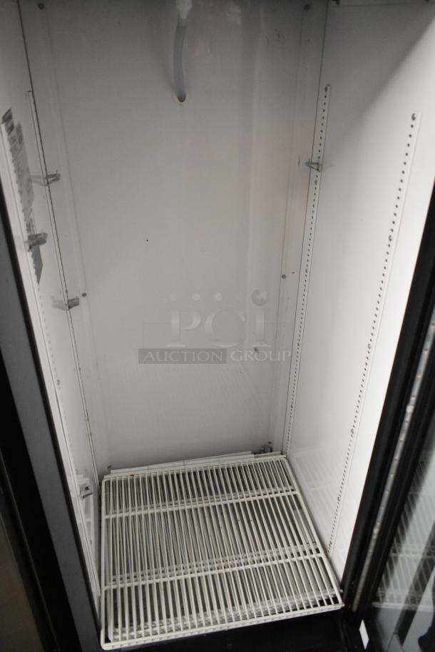 2019 True GDM-12-HC commercial cooler, single door, metal exterior, poly-coated racks, 115V, 1-phase, clean interior.