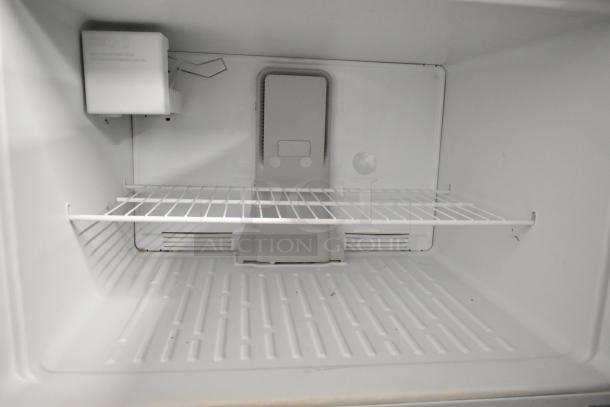 Maytag M1TXEGMYW01 single door cooler with freezer, 115V, 1 Phase; interior view showing wire shelf and cooling unit.