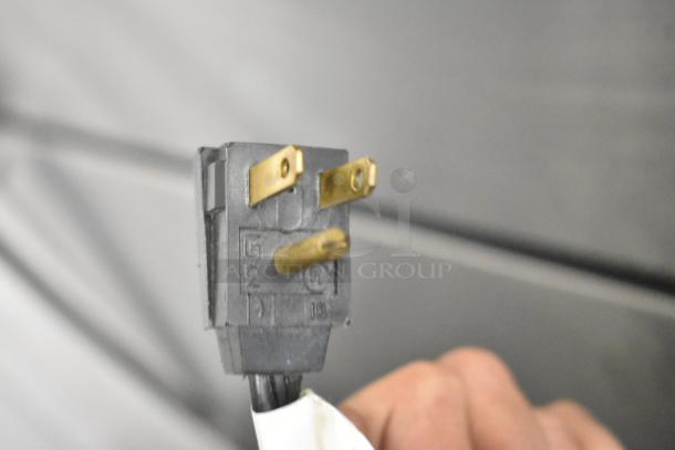 Electrical plug of 2018 Maytag WRT311FZDM01 cooler, showing prongs for 115 Volts, 1 Phase connection.