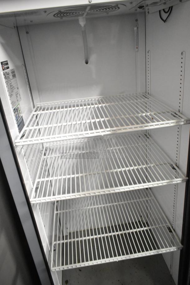 2020 True GDM-12-HC commercial cooler with single glass door, poly-coated racks, and True label. Excellent condition.