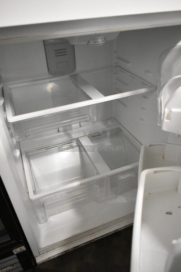 Maytag single door reach-in cooler with freezer, 115 volts, 1 phase, interior shelves, white, in good condition.