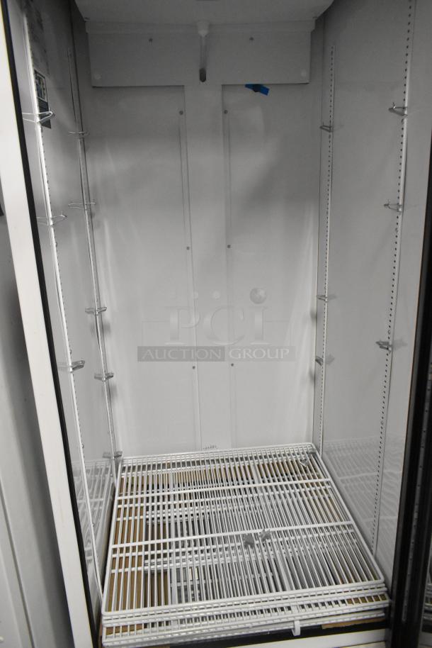 2021 True TSCI-600R-G-PH Reach-In Cooler Merchandiser, single door, poly-coated racks, metal, 115 volts, 1 phase, excellent condition.