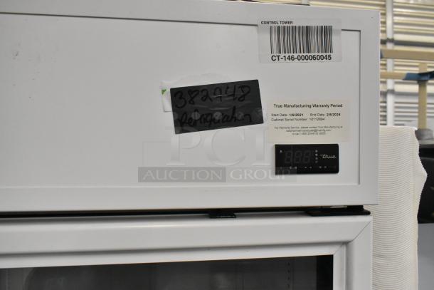 2021 True TSCI-600R-G-PH Commercial Cooler, single door, poly coated racks, 115V, warranty tag visible.