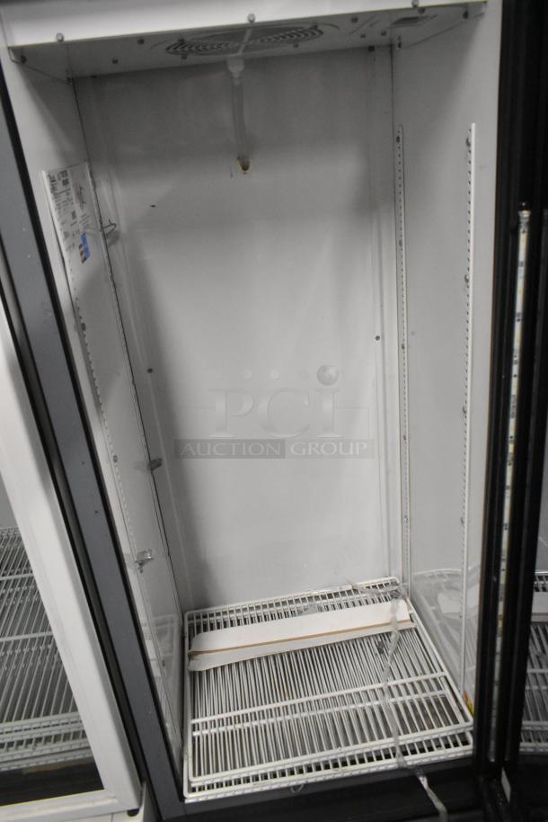 True GDM-12-LD commercial cooler, single door, metal frame, white wire racks, minor wear, 115V, 1 phase.
