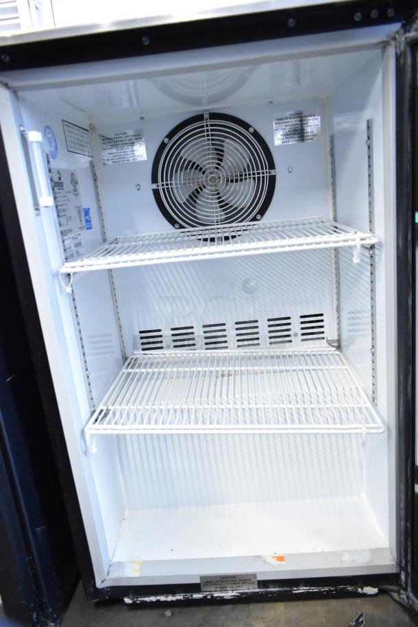 Imbera EVC04 Metal Mini Cooler Merchandiser, 115 Volts, 1 Phase. Features metal shelves, rear fan, and safety labels.