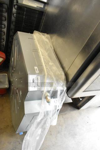 LG ARNU363TMA4 metal commercial evaporator fan, new condition, 208/230V, 1 phase, with visible labels, wrapped in plastic.