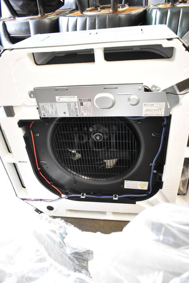 LG ARNU363TMA4 metal commercial evaporator fan, 208/230V, 1 phase, includes visible safety labels and wiring connections.