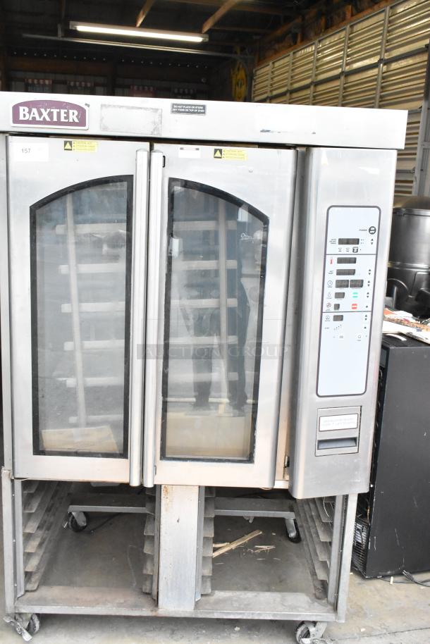 Baxter OV310G stainless steel mini rotating rack oven, commercial natural gas, 95,000 BTU, on double pan rack with casters.
