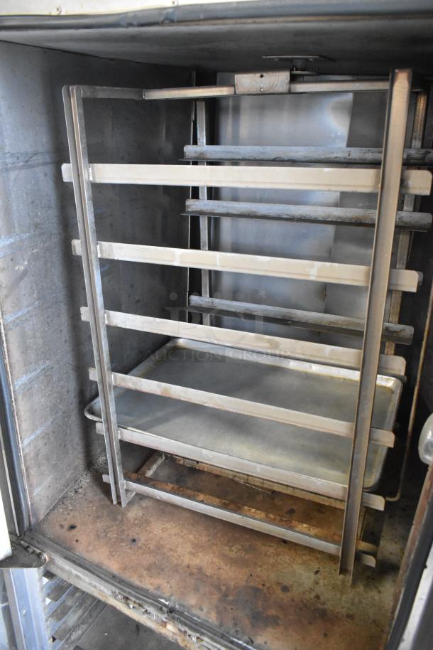 Baxter OV310G stainless steel rotating rack oven, 95,000 BTU, on double pan rack with commercial casters, natural gas powered.