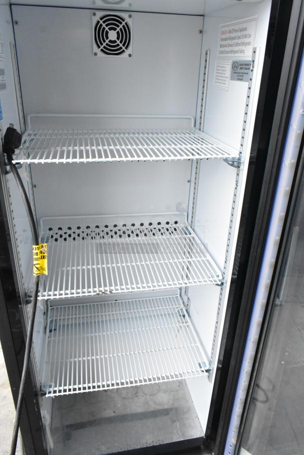 2021 IDW G4-H0234B Metal Mini Cooler Merchandiser, 110-120V, 1 Phase, clean interior, multiple shelves, visible warning labels.