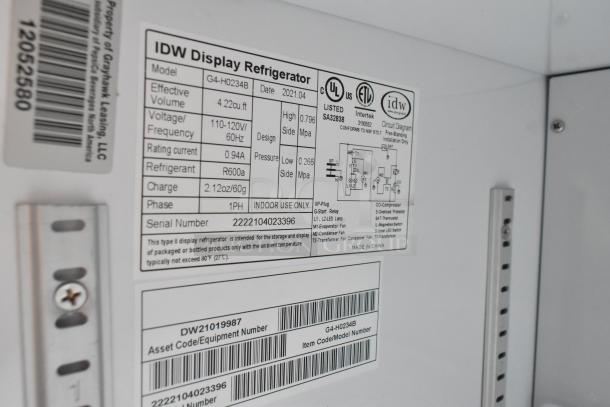 2021 IDW G4-H0234B metal mini cooler with 110-120V, 1 phase, R600a refrigerant. Serial number and technical details listed.