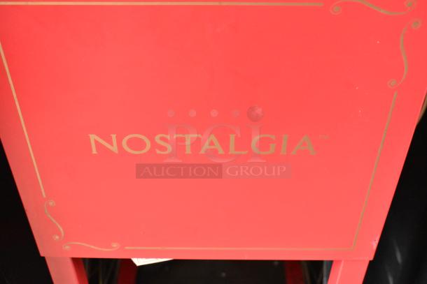 Nostalgia CCP510 Metal Vintage Popcorn Cart with gold "Nostalgia" branding. Red finish. Model CCP510. 120V, 1 Phase.