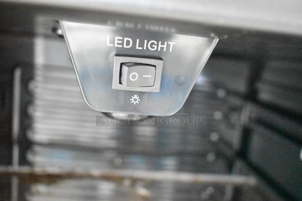 Arctic King ARV115B1AST mini cooler interior showing LED light switch, features 110-120V, 1 phase power.