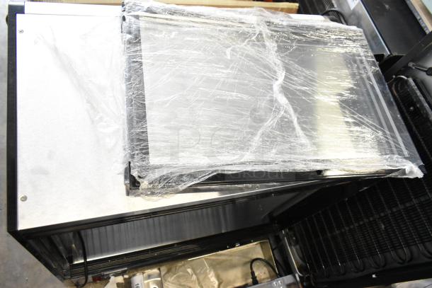 Brand new KoolMore CDC-69-SS 4-tier commercial display fridge with protective wrap. Scratch and dent condition. 120 Volts, 1 Phase.