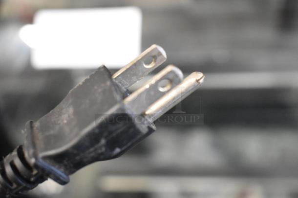 Close-up of a 120V plug for VacPak-It 186VMC10OP Stainless Steel Chamber Vacuum Packaging Machine, showcasing electrical compatibility.