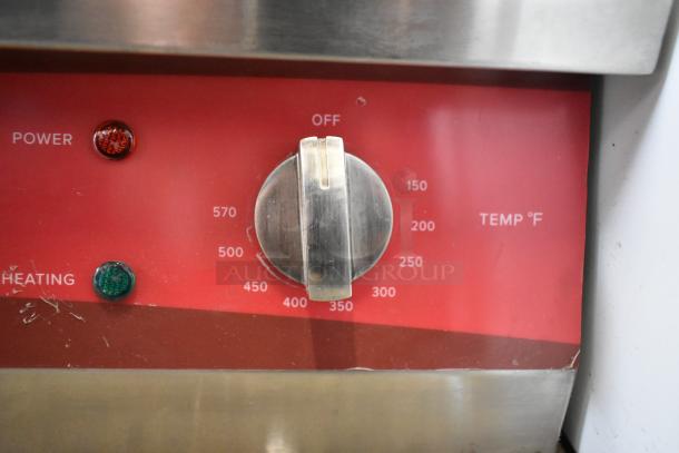 Avantco 177EG30N griddle control panel with temperature dial and indicator lights. Scratches visible on surface.