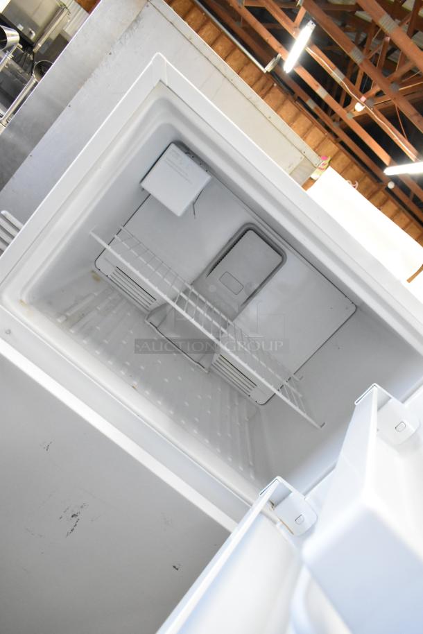 Maytag M1TXEGMYW01 single door reach-in cooler with freezer. Features 115 volts, 1 phase. Clean interior, wire shelf.