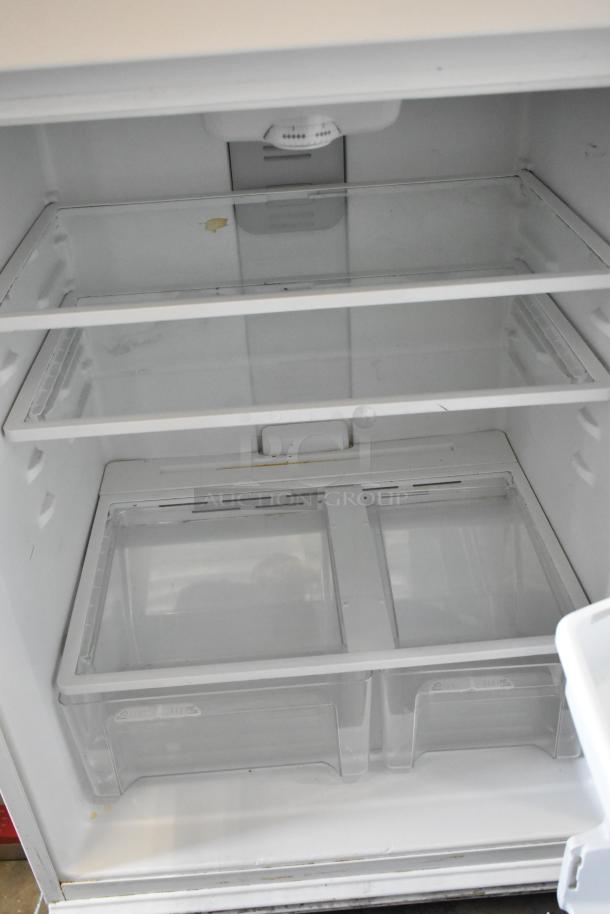 Maytag single door reach-in cooler with freezer, model M1TXEGMYW01, 115V, 1 phase, spacious interior, minor wear.
