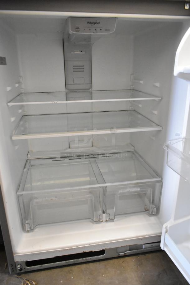 Whirlpool stainless steel single door reach-in cooler with freezer, 115 volts, 1 phase. Clean interior, adjustable shelves.