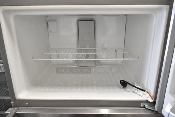 Whirlpool stainless steel reach-in cooler with freezer, single door, one wire shelf, 115 volts, 1 phase, interior shown.