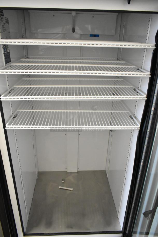 2021 True TSCI-600R-G-PH commercial cooler, single glass door, poly coated racks, 115 volts, excellent condition.