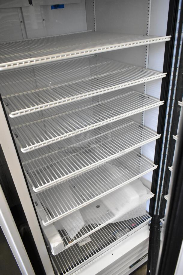 2021 True TSCI-600R-G-PH metal reach-in cooler with poly-coated racks, 115V, single-phase. Excellent condition.