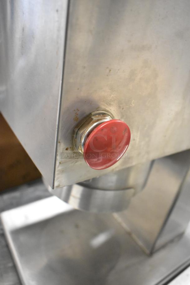 Edlund stainless steel commercial countertop unit with red button, showing slight wear, ideal for restaurant use.