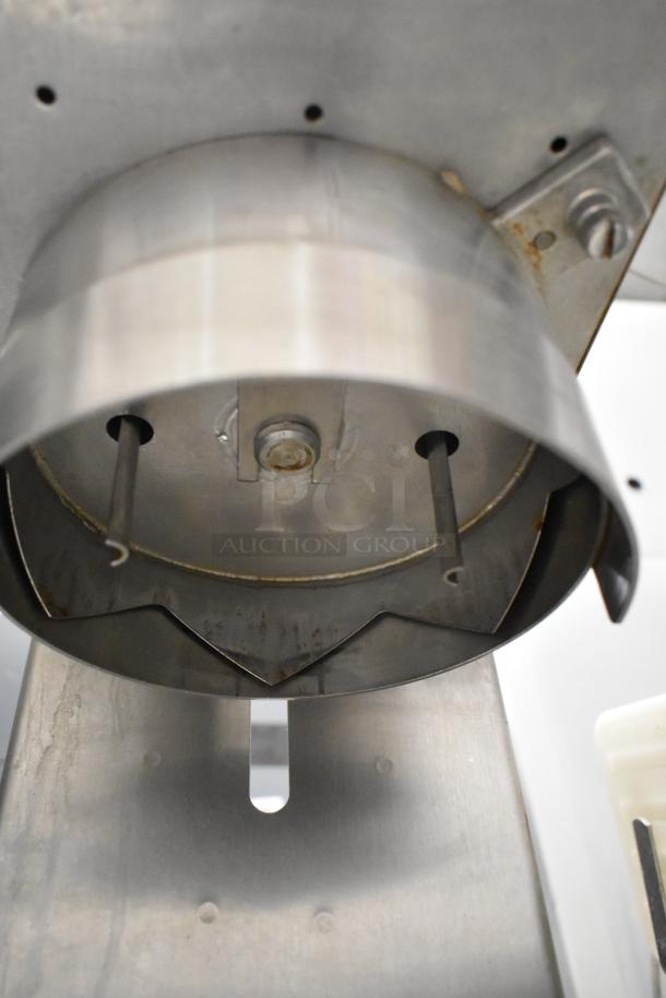 Edlund stainless steel commercial countertop unit, showing underside with sharp blades, in good condition.