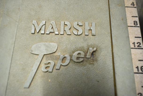 Marsh Taper 5HT gummed tape dispenser, metallic finish, embossed "MARSH Taper"; used condition, visible markings.