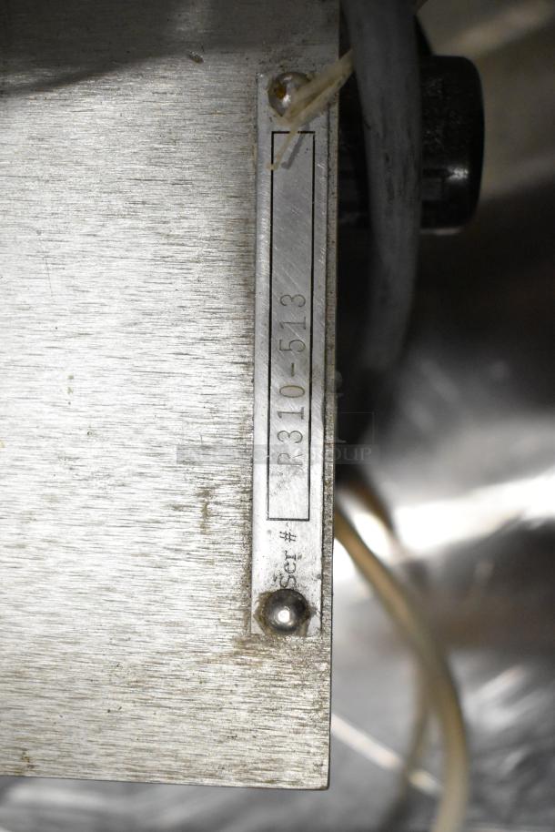 Universal Metal Countertop Unit with visible serial number R310-513, shows signs of wear.