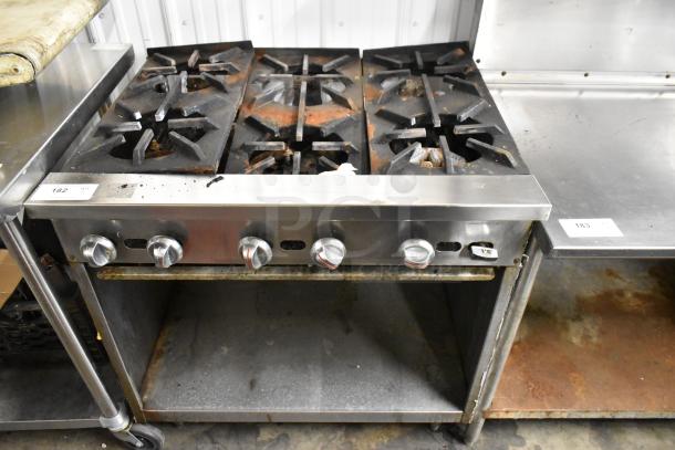 Jade Range JSR-6 commercial gas range, 6 burners, stainless steel, under shelf, visible wear, durable kitchen equipment.