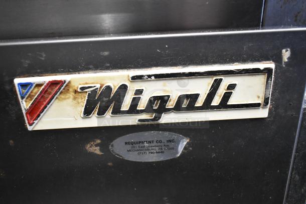 Migali CA412 logo on stainless steel commercial sandwich salad prep table, visible wear, includes company label.