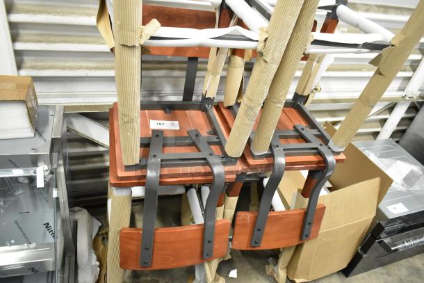 4 brand new black metal bar height chairs with wooden seats and backrests, bundled as scratch and dent.