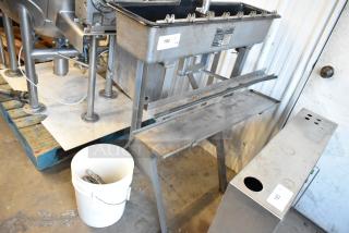 US Bottlers Machy Co metal floor siphon filler, industrial-grade, with attached label, in good used condition.