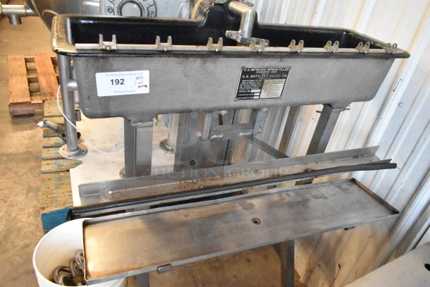 US Bottlers Machy Co metal floor-style siphon filler, labeled, gray finish, industrial condition, stainless steel construction.